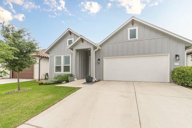 433 Skipping Cedar St, San Marcos, TX 78666 - view of front of property with board and batten siding, concrete driveway, a garage, and a front yard