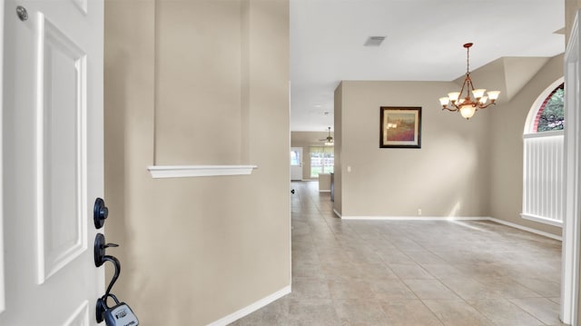 1803 Shooting Star Cv, Cedar Park, TX 78613 - foyer featuring baseboards, a chandelier, and light tile patterned floors