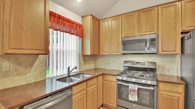 1803 Shooting Star Cv, Cedar Park, TX 78613 - kitchen with stainless steel appliances, a sink, vaulted ceiling, decorative backsplash, and light brown cabinets