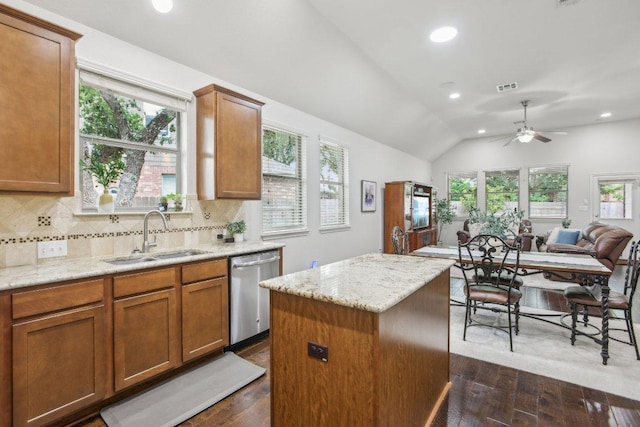 2228 Hilltop Climb Dr, Leander, TX 78641 - kitchen with a sink, stainless steel dishwasher, dark wood-style flooring, recessed lighting, and a center island