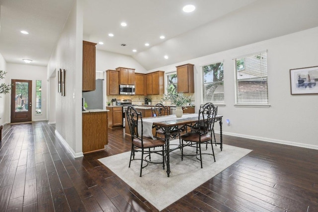 2228 Hilltop Climb Dr, Leander, TX 78641 - dining space with dark wood finished floors, recessed lighting, and lofted ceiling