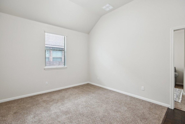 2228 Hilltop Climb Dr, Leander, TX 78641 - spare room with vaulted ceiling, baseboards, and dark colored carpet