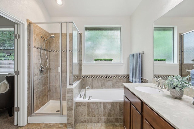 2228 Hilltop Climb Dr, Leander, TX 78641 - full bathroom with a shower stall, a garden tub, and vanity