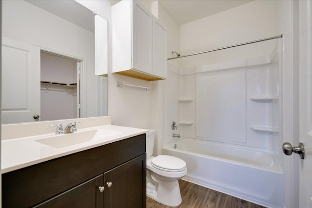 3413 Breckenridge Dr, Austin, TX 78744 - full bath with toilet, vanity, wood finished floors, and bathtub / shower combination