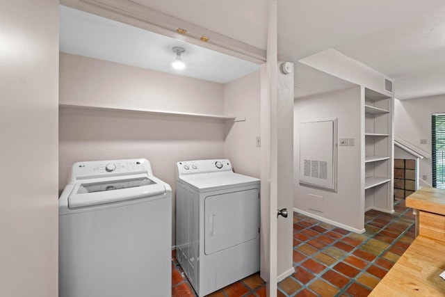 1135 Barton Hills Dr Unit 240, Austin, TX 78704 - laundry area featuring washing machine and dryer and tile patterned floors