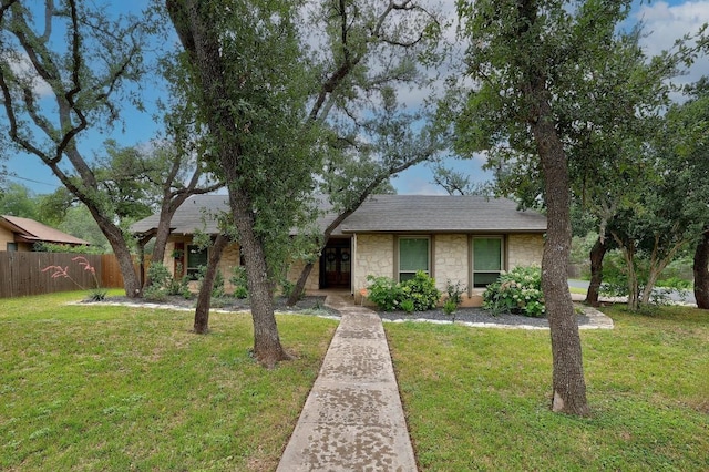 9417 Longvale Dr, Austin, TX 78729 - view of front of property featuring stone siding, french doors, and roof with shingles