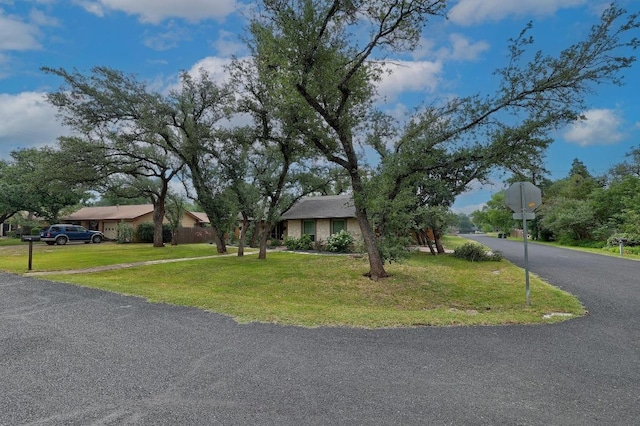 9417 Longvale Dr, Austin, TX 78729 - view of front facade featuring a front lawn and driveway