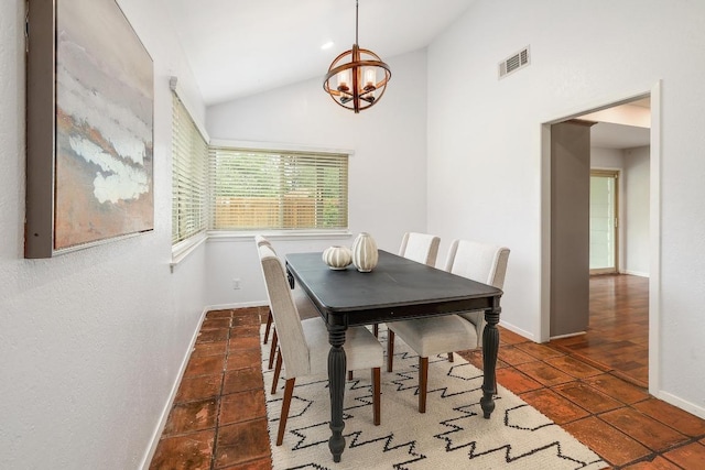 9417 Longvale Dr, Austin, TX 78729 - tiled dining space with a chandelier, vaulted ceiling, and baseboards