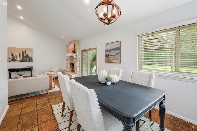 9417 Longvale Dr, Austin, TX 78729 - tiled dining room featuring a chandelier, vaulted ceiling, baseboards, and recessed lighting