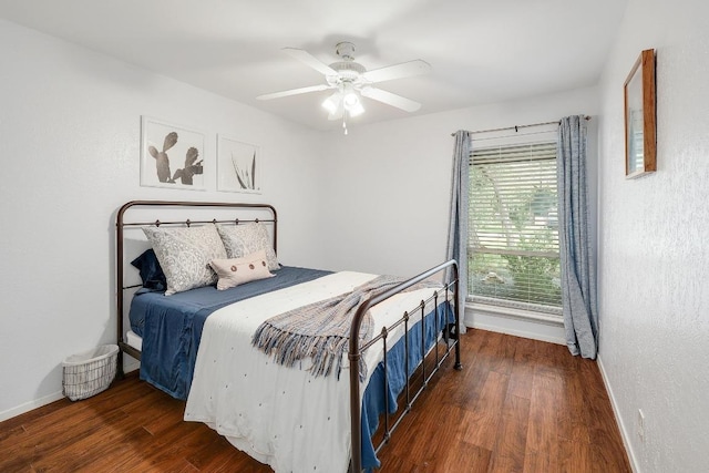 9417 Longvale Dr, Austin, TX 78729 - bedroom featuring baseboards, wood finished floors, and ceiling fan