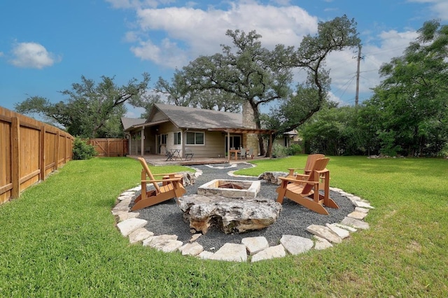 9417 Longvale Dr, Austin, TX 78729 - view of yard featuring a fire pit and a patio