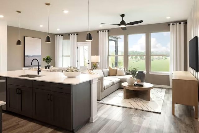2725 Woodall Dr Unit 1602, Cedar Park, TX 78613 - kitchen featuring a sink, light countertops, a ceiling fan, light wood finished floors, and recessed lighting