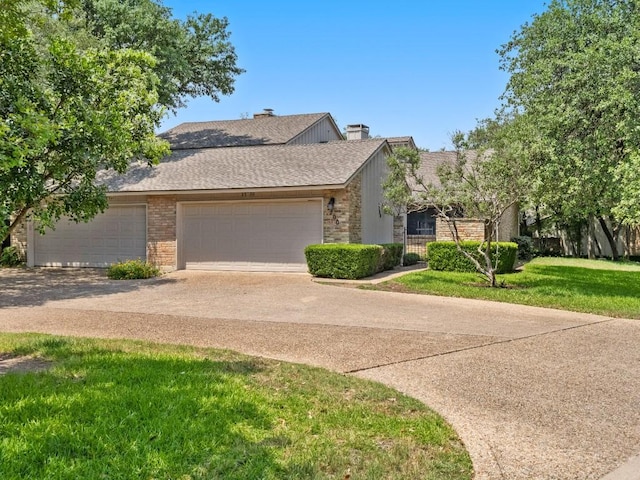 3700 Steck Ave, Austin, TX 78759 - view of front of property with concrete driveway, a garage, a chimney, a shingled roof, and brick siding