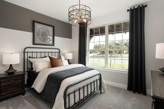 508 Canyoncrest Way, Liberty Hill, TX 78642 - bedroom with carpet flooring, baseboards, and a chandelier