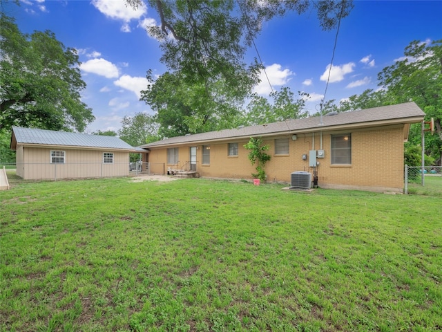 302 Vernon St, Thrall, TX 76578 - rear view of house with brick siding and central air condition unit