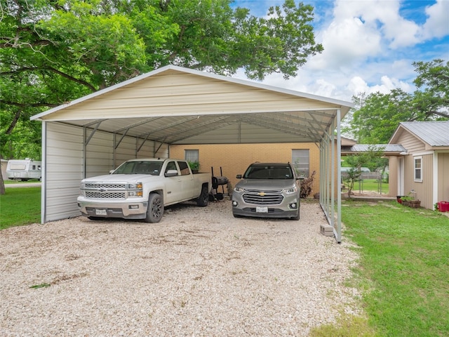 302 Vernon St, Thrall, TX 76578 - view of parking featuring a carport and driveway
