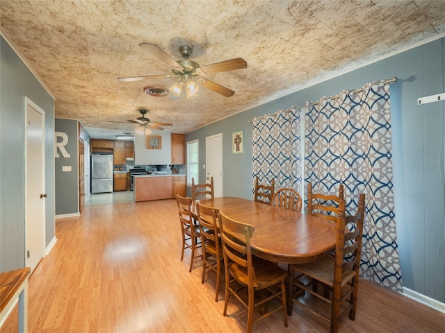 302 Vernon St, Thrall, TX 76578 - dining space with ceiling fan, light wood-style floors, and baseboards
