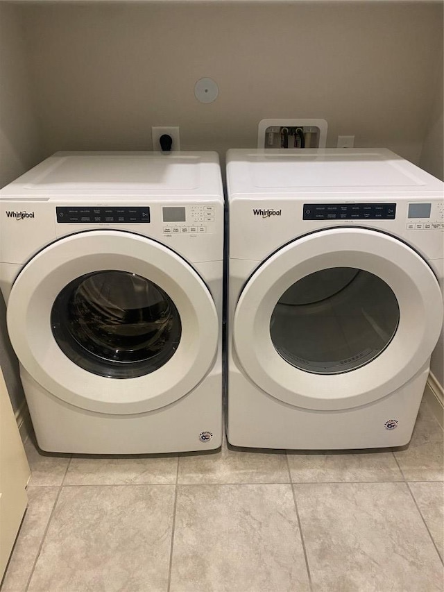 104 Bella Toscana Ave Unit 2106, Austin, TX 78734 - laundry room featuring separate washer and dryer and light tile patterned floors