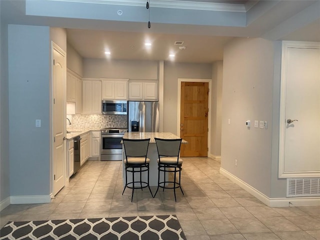 104 Bella Toscana Ave Unit 2106, Austin, TX 78734 - kitchen with stainless steel appliances, light tile patterned floors, tasteful backsplash, baseboards, and crown molding