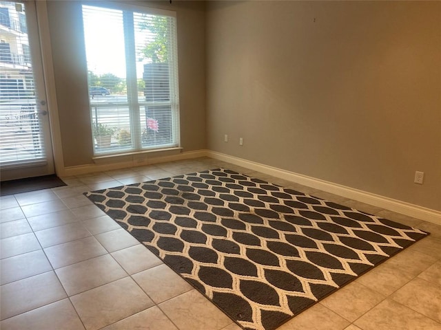 104 Bella Toscana Ave Unit 2106, Austin, TX 78734 - empty room with tile patterned flooring, healthy amount of natural light, and baseboards