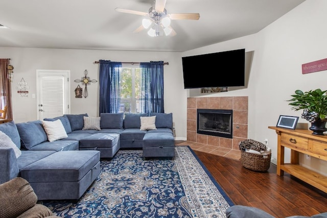 1115 Henderson Dr, Leander, TX 78641 - living area with wood finished floors, a fireplace, and a ceiling fan