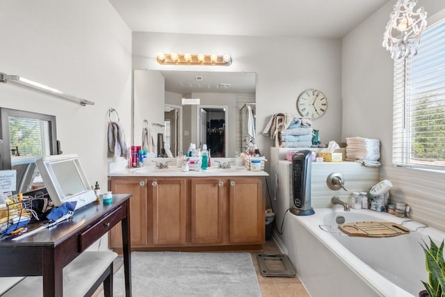 1115 Henderson Dr, Leander, TX 78641 - full bathroom with plenty of natural light, a bath, double vanity, and tile patterned floors