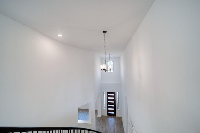 3321 Mongolian Dr, Leander, TX 78641 - stairs featuring wood finished floors, a chandelier, recessed lighting, and baseboards