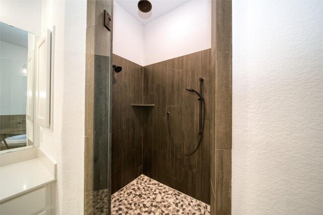 3321 Mongolian Dr, Leander, TX 78641 - bathroom featuring tiled shower and vanity