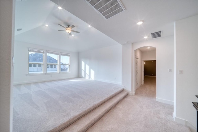 3321 Mongolian Dr, Leander, TX 78641 - empty room featuring light colored carpet, arched walkways, baseboards, a ceiling fan, and recessed lighting
