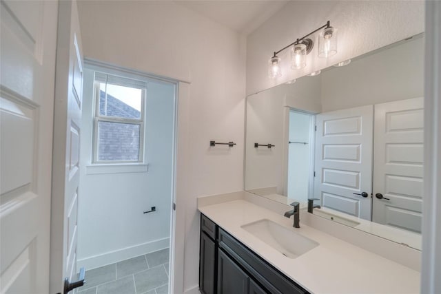 3321 Mongolian Dr, Leander, TX 78641 - bathroom featuring vanity, tile patterned floors, and baseboards