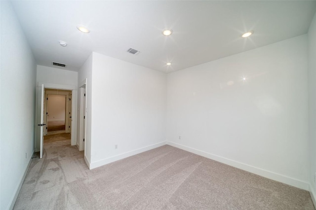 3321 Mongolian Dr, Leander, TX 78641 - empty room featuring light carpet, baseboards, recessed lighting, and a smoke detector