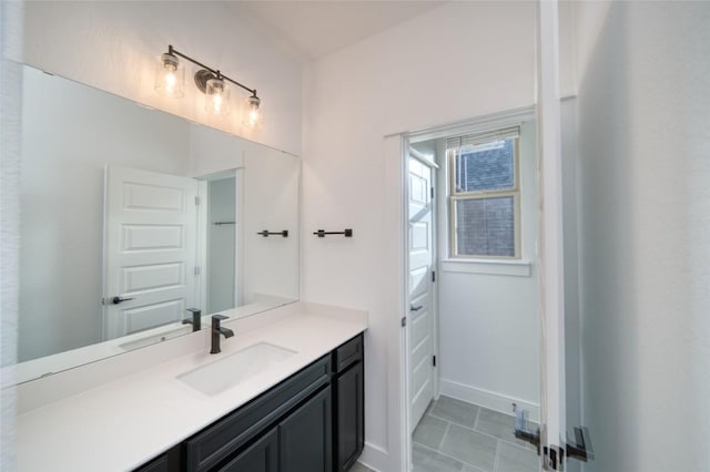 3321 Mongolian Dr, Leander, TX 78641 - bathroom featuring vanity, baseboards, and tile patterned floors