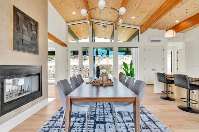 18408 F M Road 1431, Jonestown, TX 78645 - dining space with a wood ceiling with exposed beams, light wood finished floors, a multi sided fireplace, recessed lighting, and high vaulted ceiling