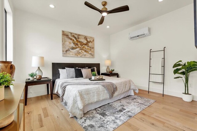18408 F M Road 1431, Jonestown, TX 78645 - bedroom featuring a wall mounted air conditioner, light wood-style floors, recessed lighting, and ceiling fan