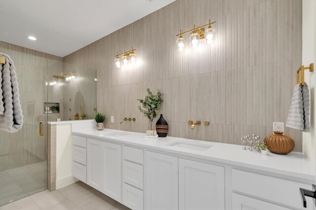 18408 F M Road 1431, Jonestown, TX 78645 - bathroom featuring a stall shower, double vanity, tile patterned floors, and tile walls