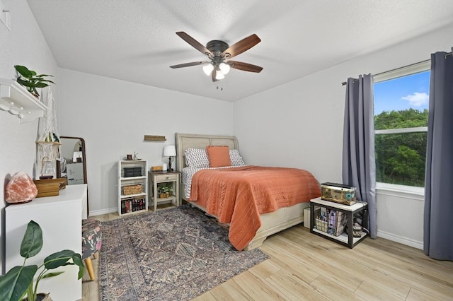 16240 Toby Ct, Temple, TX 76502 - bedroom with wood finished floors, ceiling fan, and baseboards