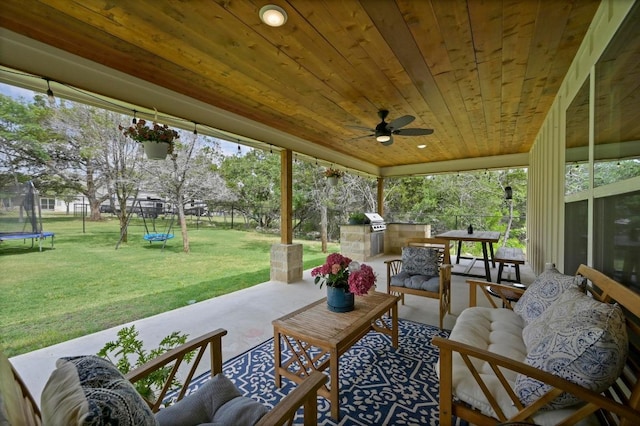16240 Toby Ct, Temple, TX 76502 - view of patio / terrace with a trampoline, an outdoor kitchen, an outdoor hangout area, and a ceiling fan