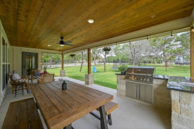 16240 Toby Ct, Temple, TX 76502 - view of patio featuring a trampoline, outdoor dining area, and a ceiling fan