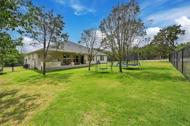 16240 Toby Ct, Temple, TX 76502 - view of yard with a trampoline, a patio area, and a gate