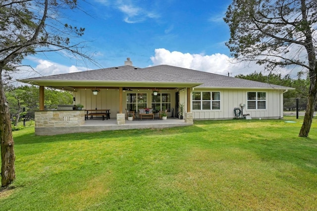 16240 Toby Ct, Temple, TX 76502 - back of property featuring board and batten siding, a ceiling fan, a yard, and a patio area
