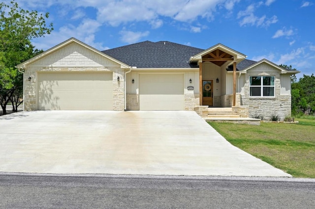 16240 Toby Ct, Temple, TX 76502 - single story home featuring a garage, stone siding, and driveway