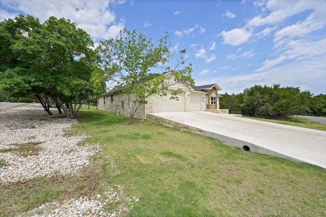 16240 Toby Ct, Temple, TX 76502 - view of front facade with concrete driveway, an attached garage, and a front lawn