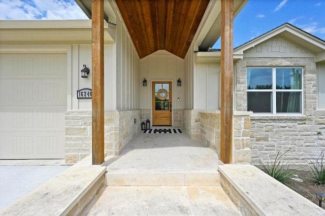 16240 Toby Ct, Temple, TX 76502 - property entrance featuring stone siding, board and batten siding, and a garage