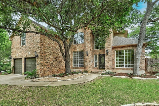 6116 Pebble Garden Ct, Austin, TX 78739 - traditional-style home featuring driveway, an attached garage, a shingled roof, and brick siding