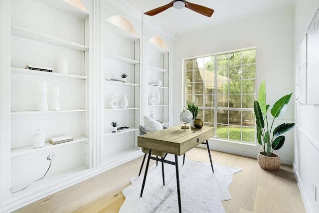 6116 Pebble Garden Ct, Austin, TX 78739 - office featuring crown molding, healthy amount of natural light, wood finished floors, ceiling fan, and built in features