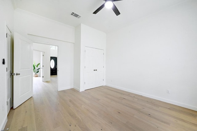 6116 Pebble Garden Ct, Austin, TX 78739 - unfurnished bedroom with light wood-style floors, baseboards, ceiling fan, and crown molding
