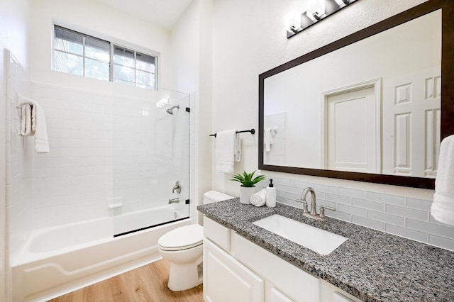6116 Pebble Garden Ct, Austin, TX 78739 - bathroom with toilet, tasteful backsplash, shower / bath combination, wood finished floors, and vanity