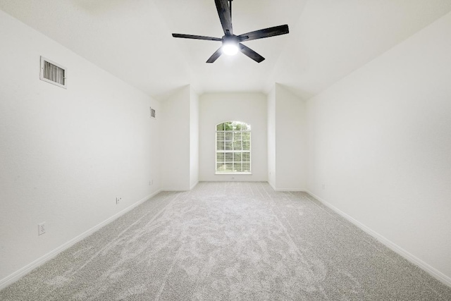 6116 Pebble Garden Ct, Austin, TX 78739 - spare room featuring ceiling fan, light colored carpet, baseboards, and vaulted ceiling