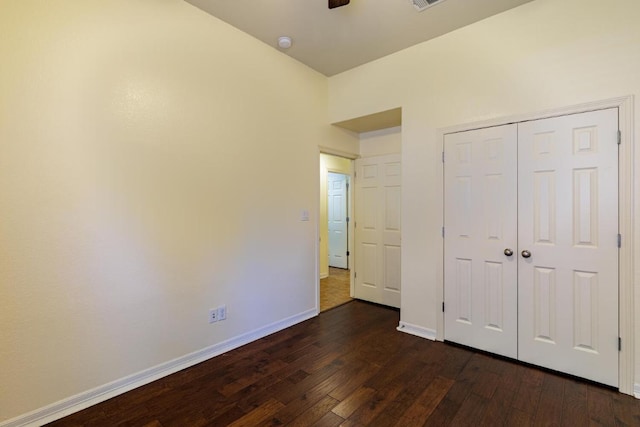 4308 Clear Meadow Pl, Round Rock, TX 78665 - unfurnished bedroom featuring dark wood-style flooring, baseboards, a closet, and a ceiling fan