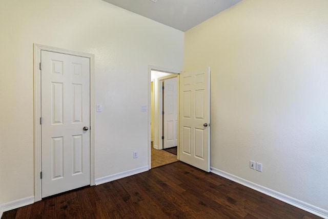 4308 Clear Meadow Pl, Round Rock, TX 78665 - unfurnished bedroom with dark wood finished floors and baseboards